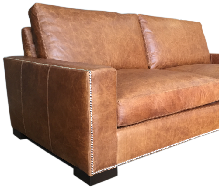 Custom application of nail head trim for your leather furniture