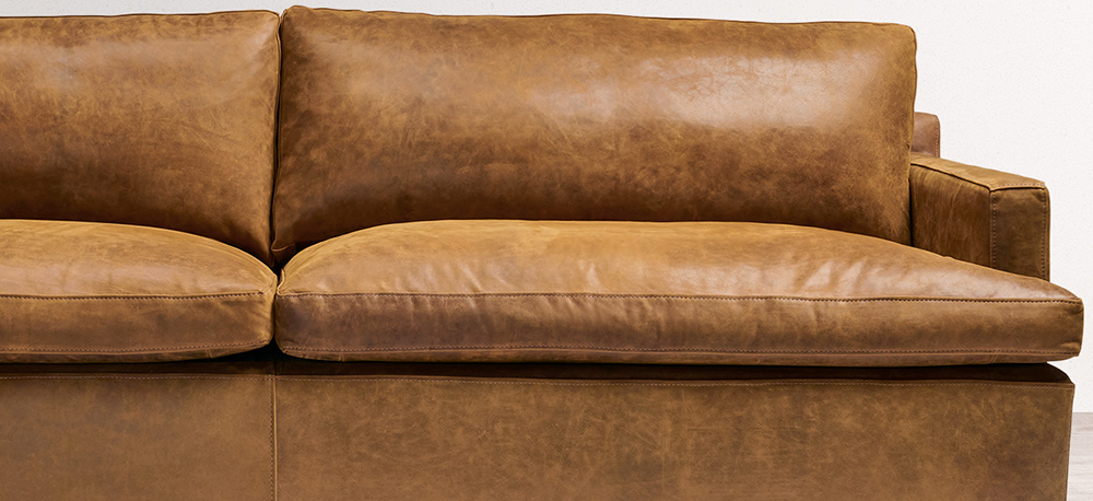 The Muir Track Arm Leather Furniture Collection, shown in Burnham Sycamore Nubuck leather